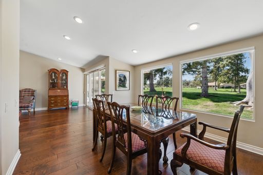 Comfortable California home with open-plan living, cozy bedrooms, golf course views, and lush backyard perfect for family living.
