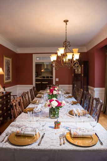 A vertical shot of a beautifully set up dining table in the house