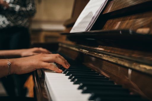 A female's hands playing the piano