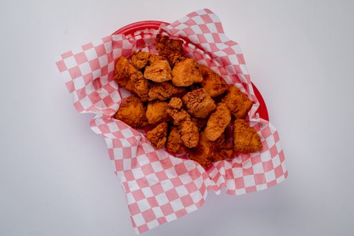 A closeup top view of a fried chicken bites isolated on a white background