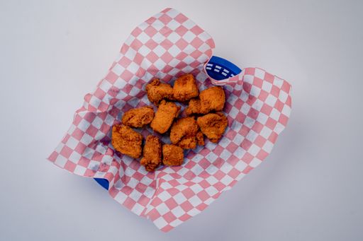 A closeup top view of a fried chicken bites isolated on a white background