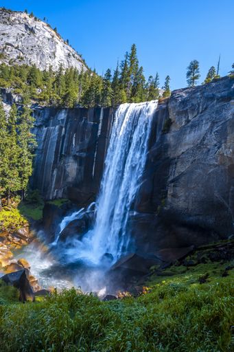 A vertical beautiful shot of the Vernal Falls waterfall of Yosemite National Park in the USA