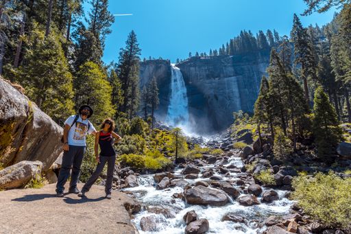 A couple hiking in the Vernal Falls waterfall of Yosemite National Park in the USA