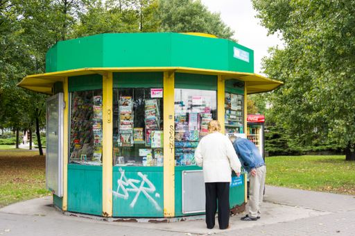 An urban view of people buying things in a typical kiosk in Poznan city, Poland