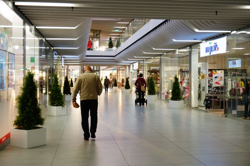 The people walking in the Pasaz Rondo shopping mall in Poznan, Poland