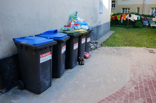 A number of containers by apartment buildings in Poznan, Poland