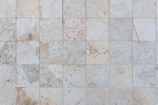 A checkerboard background of marble imitation tiles