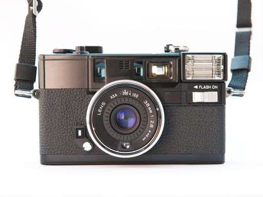 closeup photo of old vintage camera on white background