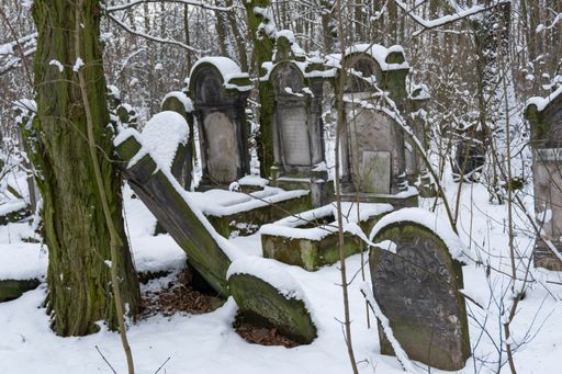 A Jewish graveyards covered by snow on a cold morning located in Warsaw, Poland
