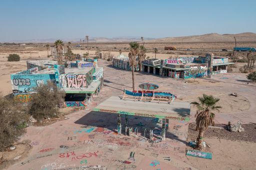 A view of the entrance gate and concessions buildings at the site of the abandoned Lake Dolores Waterpark near Barstow.