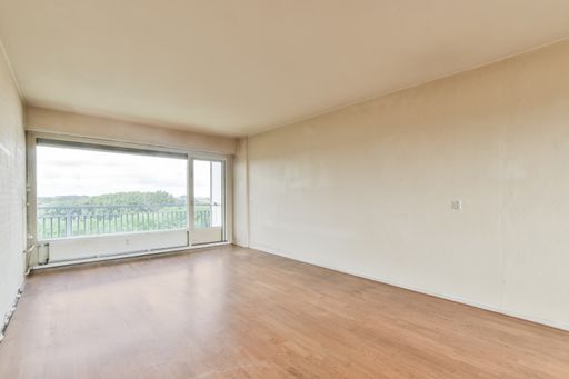 An empty laminated room with no furniture - modern interior, new house
