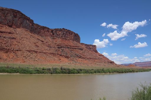 A beautiful view of the Colorado River flowing through red rock canyon near Moab, Utah