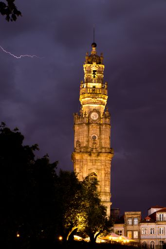 A vertical shot of the Clerigos Tower in Porto, Portugal during a stormy evening