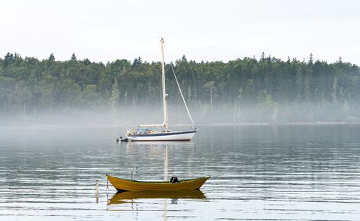The boats at Northwest Harbor in Deer Isle, Maine, USA on a foggy day