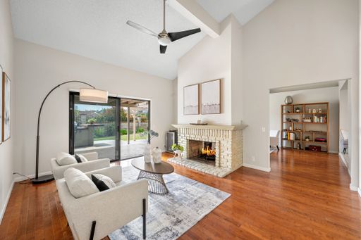 Single-level California home featuring a spacious kitchen, shaded patio, landscaped yard, and bright living spaces.