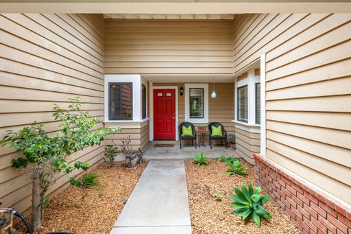 Single-level California home featuring a spacious kitchen, shaded patio, landscaped yard, and bright living spaces.