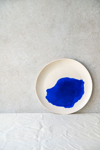 A selection of handmade ceramic pieces, vases, bowls, candleholders and plates