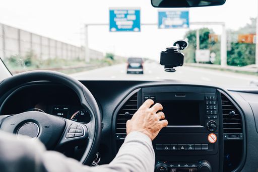 Man driving his car on the freeway. Transportation and trip concepts
