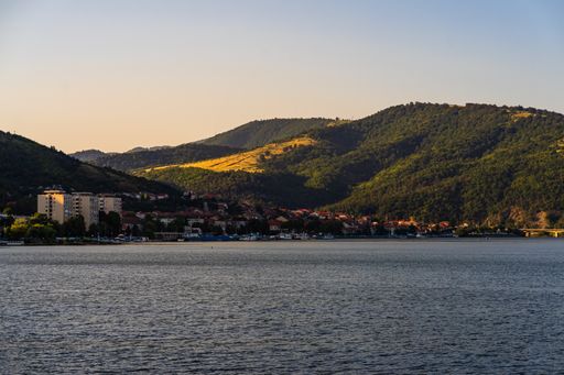 A landscape view of Danube river and Orsova city vegetation and buildings. Orsova, Romania, 2021