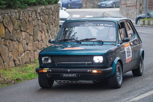 Fiat 127 rally car driven by Marco Bertelli and Paola Ferrari in the 73 Rally KH7 Costa Brava, showcasing vintage motorsport excitement