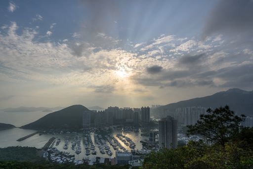 A high angle shot of the city of Hong Kong captured under the beautiful cloudy sky