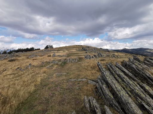 Abeautiful scene of a rocky mountain on a cloudy day
