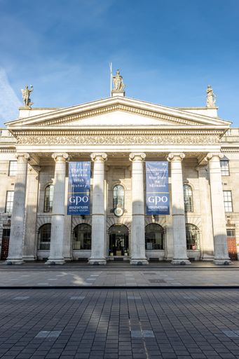 A vertical shot of the General Post Office in Dublin during the sunrise, Ireland