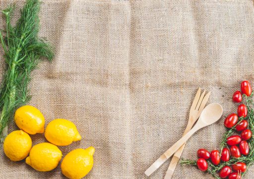An overhead shot of lime fennel thyme and tomatoes food composition for advertising