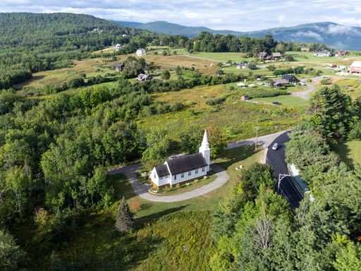 A drone shot of St Matthew's Church in Sugar Hill New Hampshire, USA