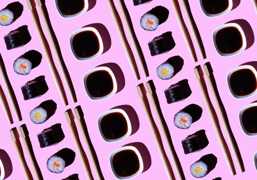 An overhead shot of various nigiri with Japanese chopsticks