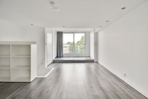 The interior of a white room with windows