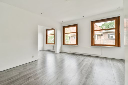 The interior of a white room with windows