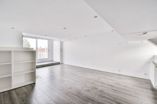 The interior of a white room with windows