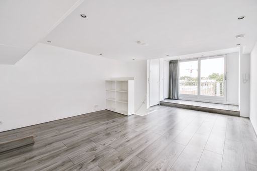 The interior of a white room with windows