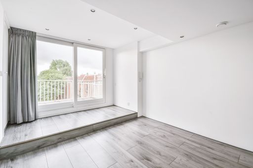 The interior of a white room with windows