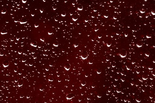 A beautiful shot of the waterdrops on the glass of a window - perfect for background