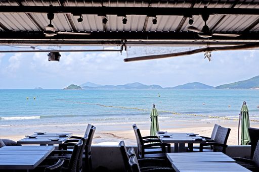 An empty outdoor restaurant cafe near a sea shore in Hong Kong