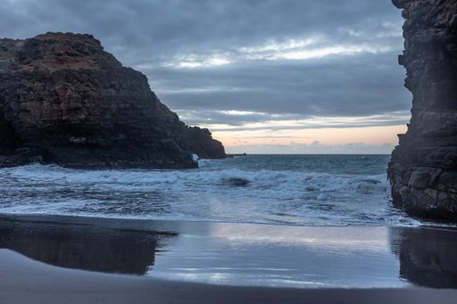 A beautiful view of a beach under the cloudy sky
