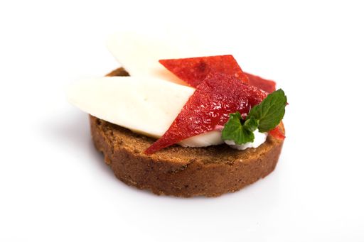 A closeup shot of delicious canape with feta cheese isolated on white background