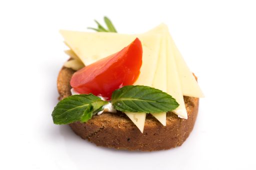 A closeup shot of delicious canape with feta cheese isolated on white background
