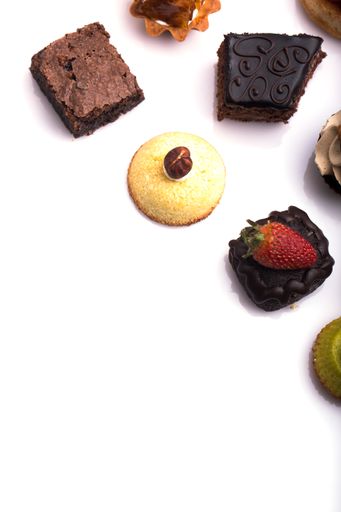 Different sweet canapes on a white table