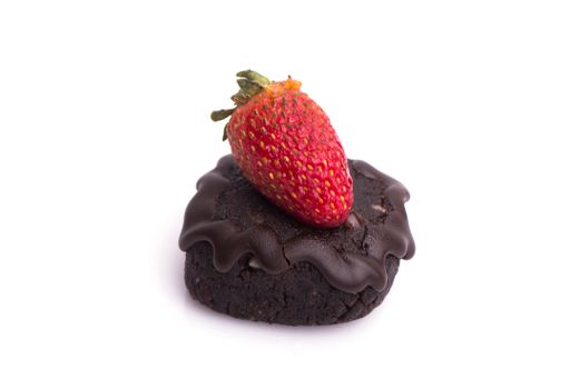 A piece of cake with a strawberry isolated on a white background
