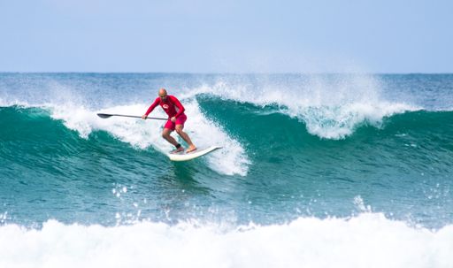 A surfer at Mole Beach on the island of Santa Catarina, Brazil