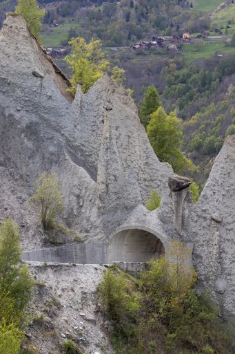 A vertical shot of a tunnel dug under the famous rock formations of Pyramides d’Euseigne in Switzerland