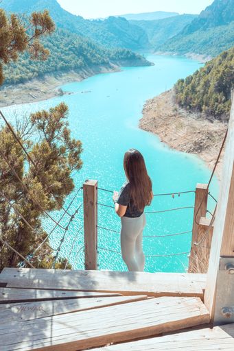 A vertical shot of a young girl at Congost de Mont-Rebei in Lleida, Catalonia, Spain