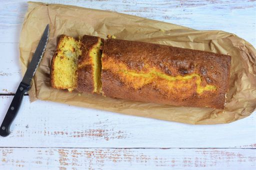 A top view of homemade fluffy cake filled with pieces of banana