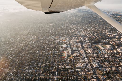 An aerial shot of a city viewed from an airplane