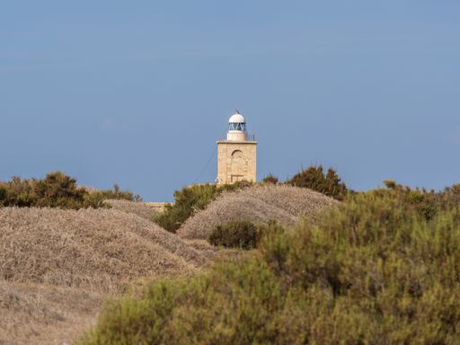 A beautiful view of Faro de Tabarca port authority building on the hill in Spain