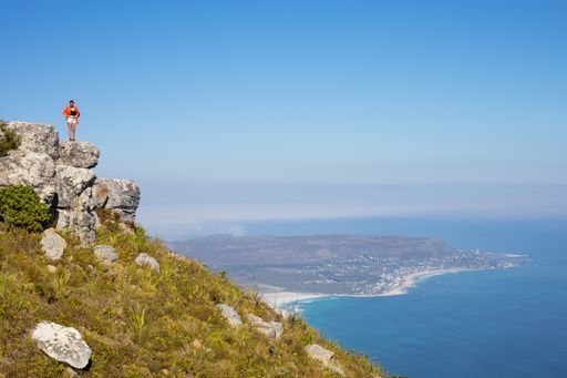 The tourists on the top of a mountain looking at the ocean view, Cape Town, South Africa