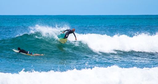 The Surfer near the Mole Beach on the island of Santa Catarina in Brazil on a sunny day